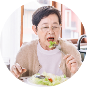 A woman with glasses eats a salad A woman with glasses eats a salad