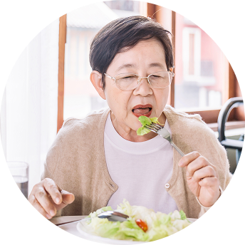A woman with glasses eats a salad A woman with glasses eats a salad