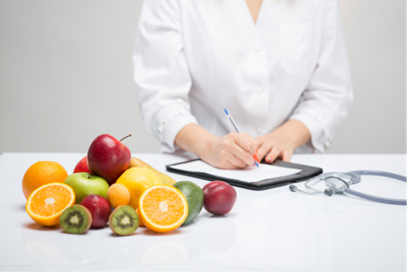 A healthcare professional writes a nutrition plan A healthcare professional writes a nutrition plan